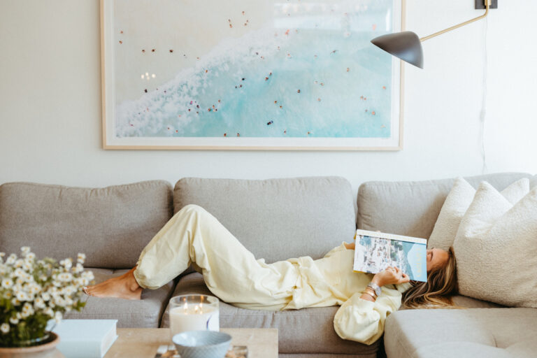 woman reading on couch