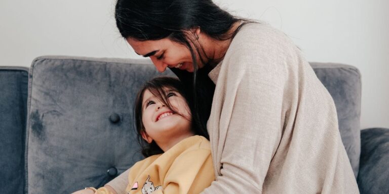 woman looking at toddler