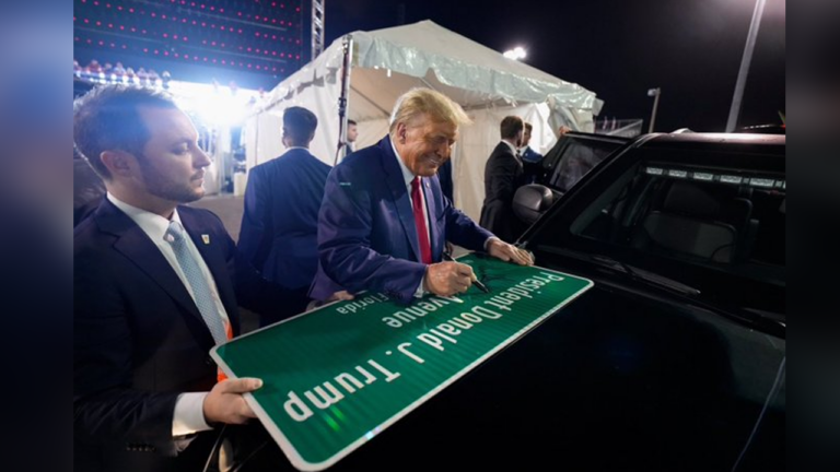 trump autographs his street sign in miami dade county