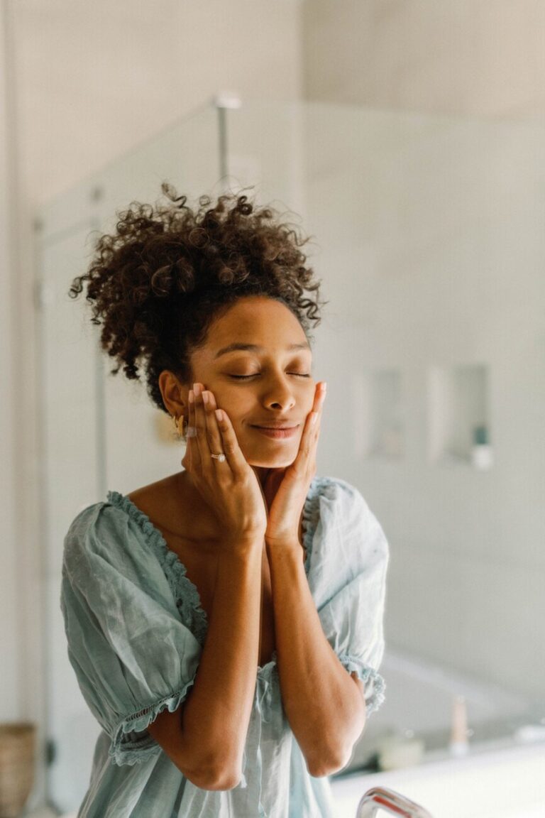 woman washing face 865x1298